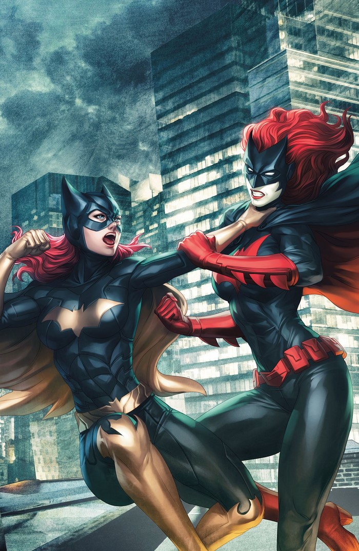 Batgirl and Batwoman fighting in a city