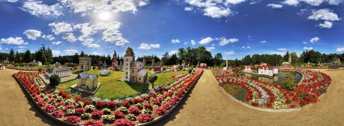 Miniature village with gardens and flowers