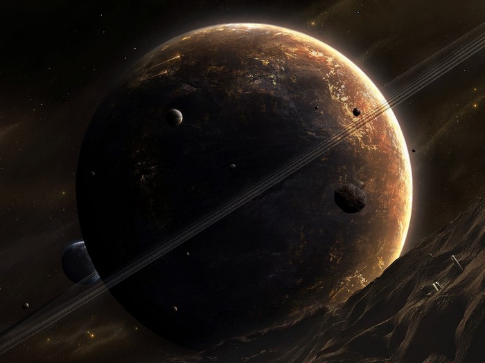 Planet with rings and moons in outer space