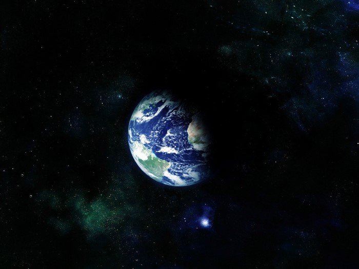 Earth in outer space with stars and nebulae