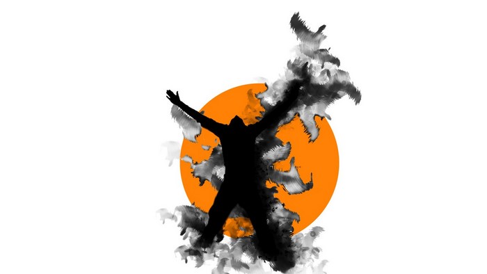 Silhouette of a person with arms raised in front of an orange circle and black ink splashes