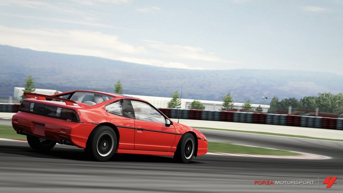 Red Pontiac Fiero GT on a race track, Forza Motorsport 4