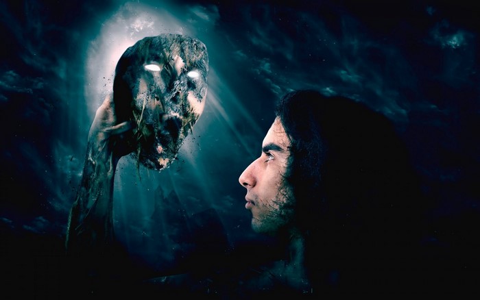 Man holding a monstrous mask