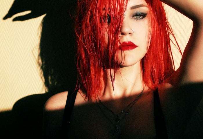 Woman with red hair and red lipstick