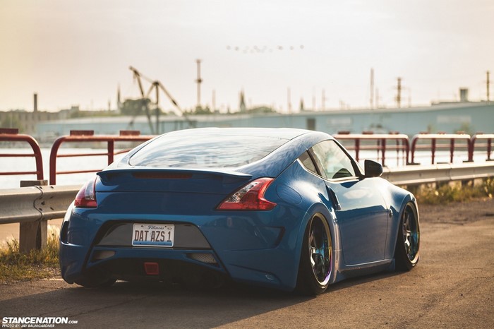 Blue Nissan 370Z with custom wheels