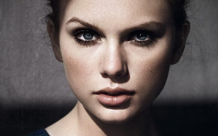 Taylor Swift portrait with blue eyes and dark makeup