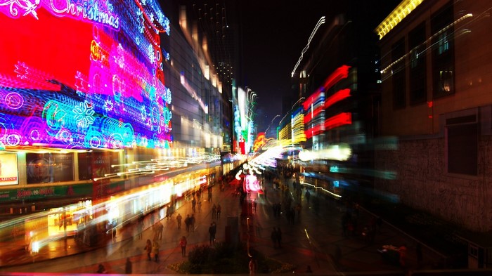 Night cityscape with Christmas lights and light trails