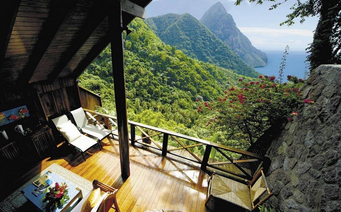 Balcony overlooking lush green mountains and the sea