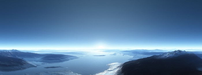 Snowy mountains and a fjord at sunrise