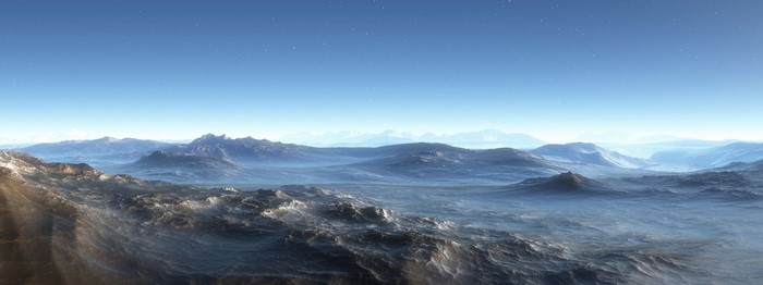 Panoramic view of a misty, mountainous landscape with ocean waves