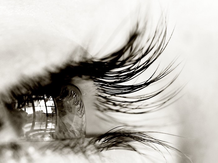 Close-up macro photography of a human eye with reflection