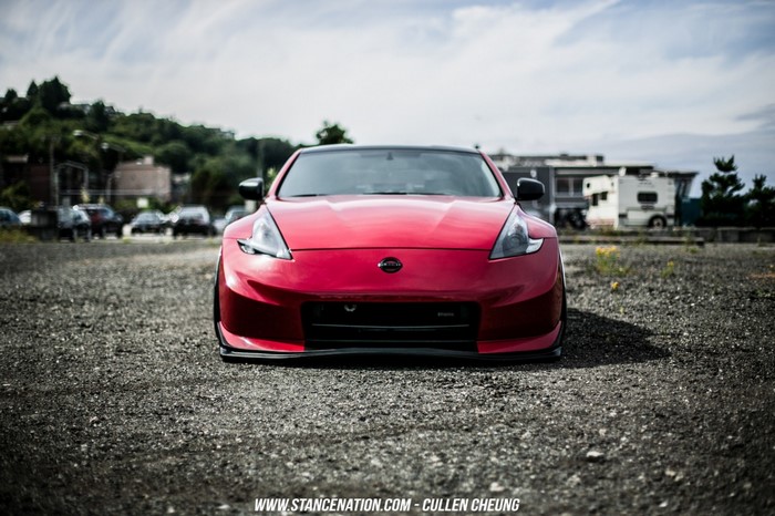 Red Nissan 370Z sports car on gravel