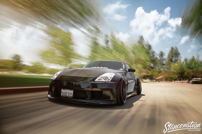 Black Nissan 350Z with widebody kit on the road