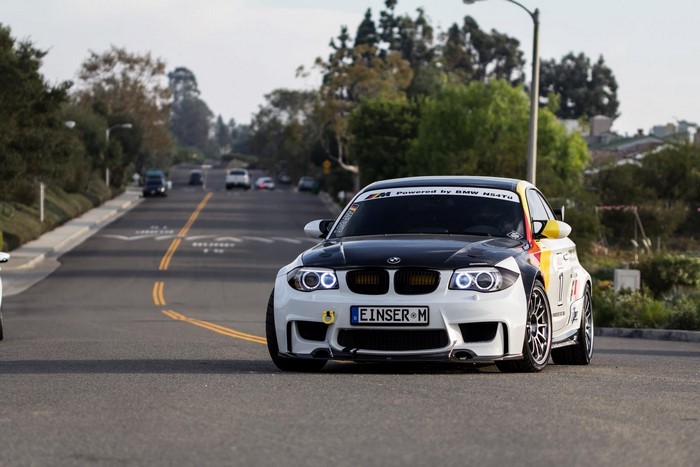 BMW M car with racing decals on a street