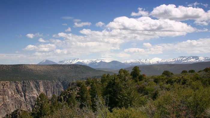 Snow-capped mountains and a canyon overlook
