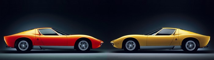 Two Lamborghini Miura sports cars, orange and yellow