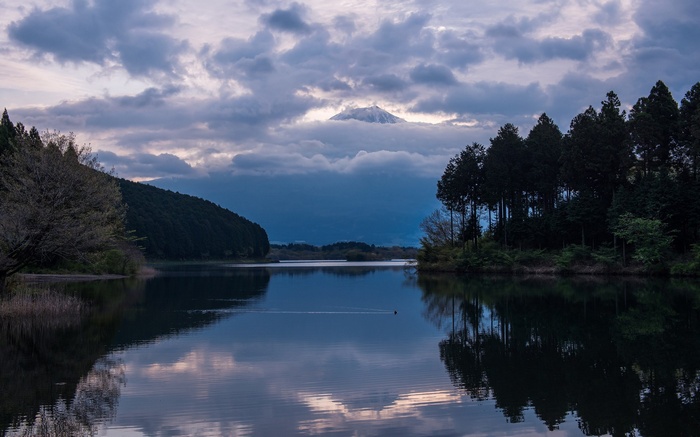 Mount Fuji over a lake at dusk