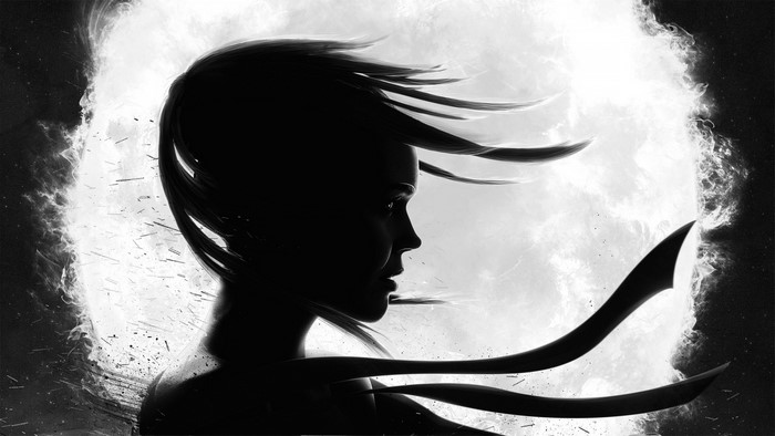 Silhouette of a woman with flowing hair against a bright background