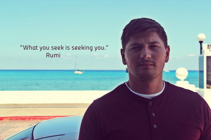 Man with quote by the sea