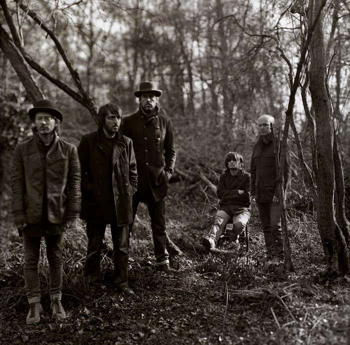 Radiohead band members in a forest