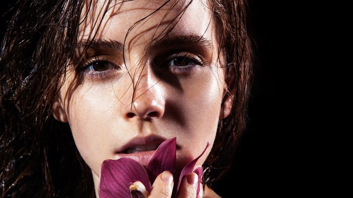 Emma Watson with a purple flower