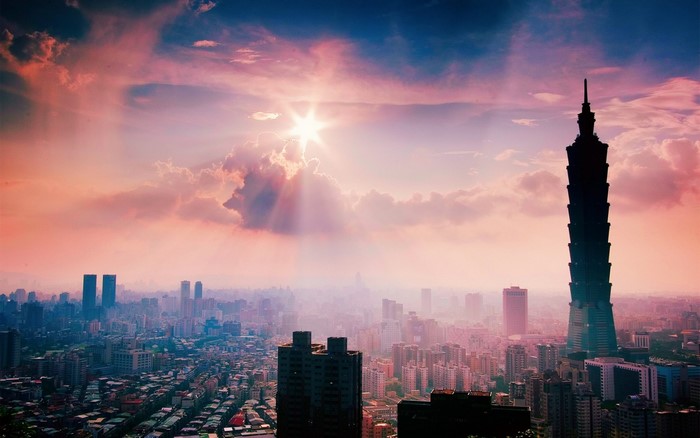 Taipei 101 skyscraper at sunset with city skyline
