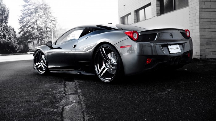 Ferrari 458 Italia parked next to a building