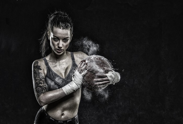 Woman boxer with basketball and chalk