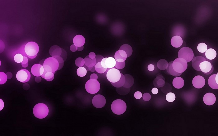 Purple bokeh lights on a dark background