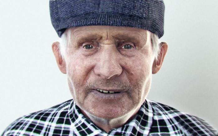 Elderly man wearing a cap and plaid shirt