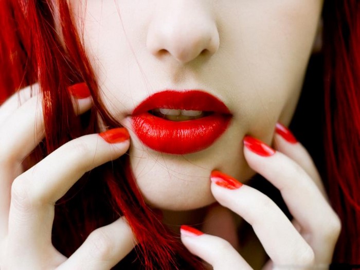 Woman with red hair and red lipstick