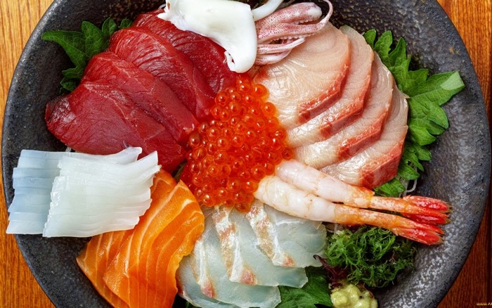 Sashimi platter with tuna, salmon, shrimp, and squid