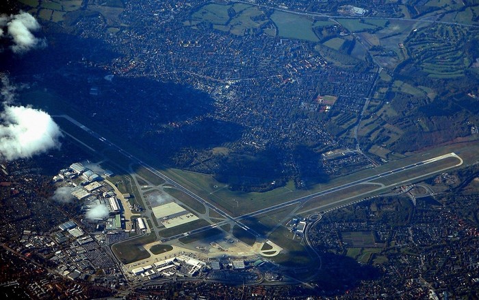 Aerial view of an airport with runways and buildings