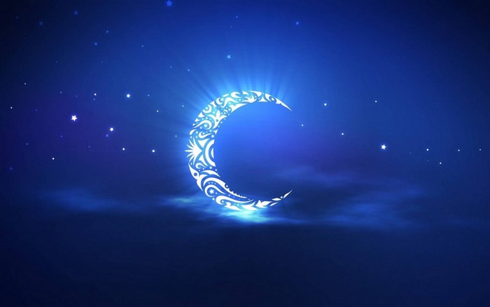 Crescent moon with ornate patterns in starry night sky