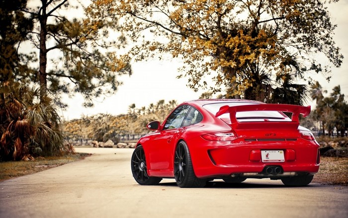 Red Porsche 911 GT3 parked on a road
