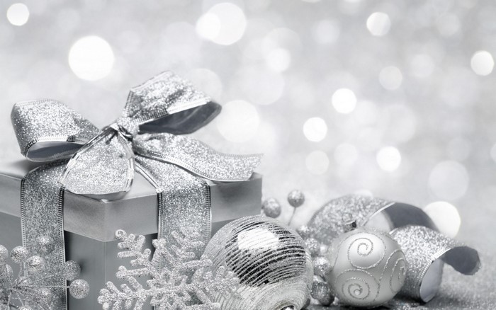 Silver Christmas gift box with ornaments and snowflakes