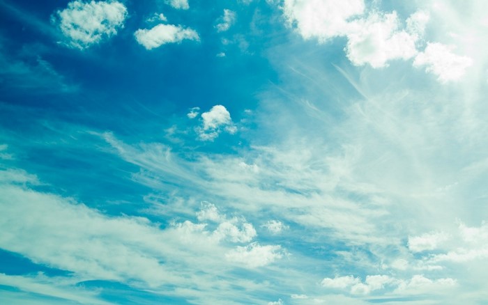 Blue sky with white clouds and sunlight