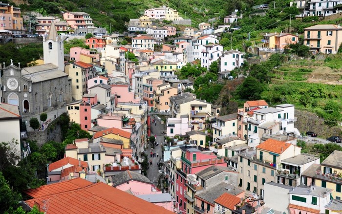 Colorful Italian village on a hillside with a church