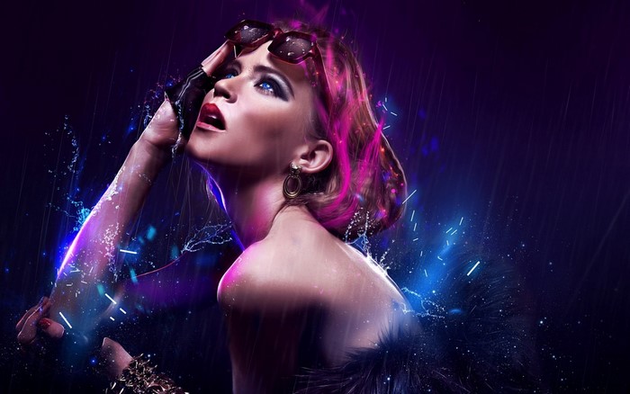 Woman with pink hair and sunglasses in the rain