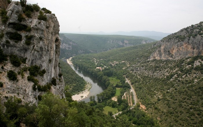 River valley with cliffs and forested mountains
