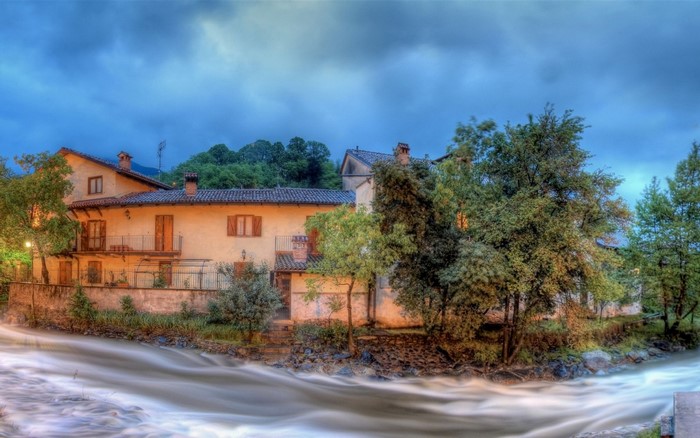 River flowing past houses in a rural village