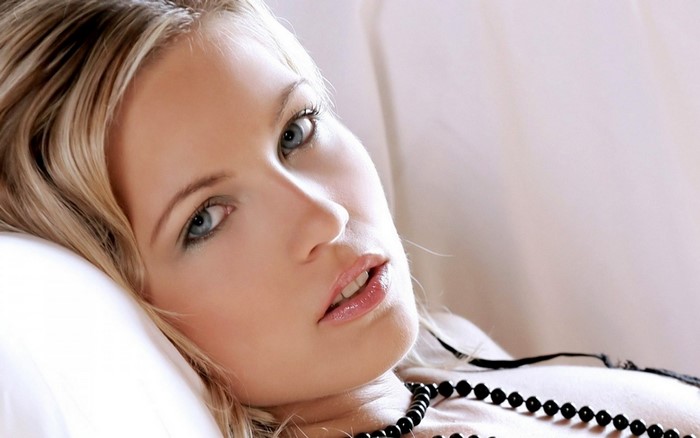 Close up portrait of a blonde woman with blue eyes