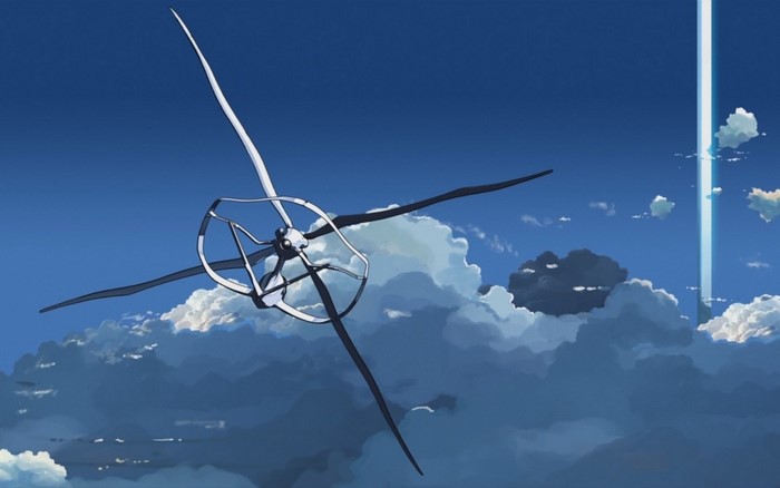 Wind turbine in the sky with clouds and light beam