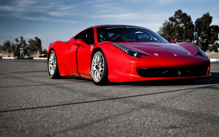 Red Ferrari 458 Italia on asphalt track
