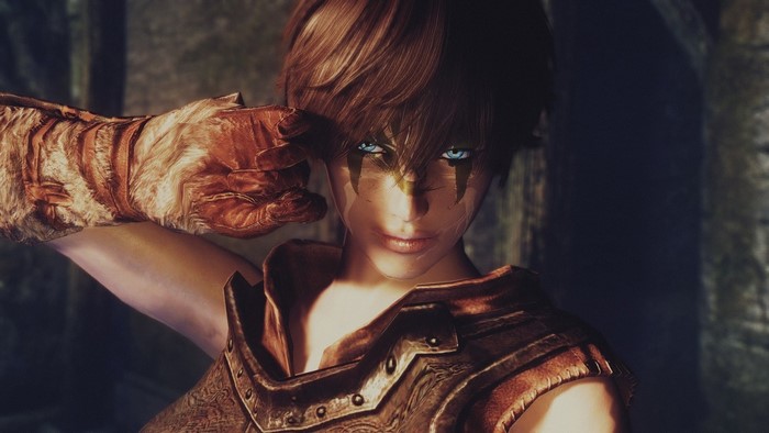 Woman warrior with blue eyes and face paint from Skyrim