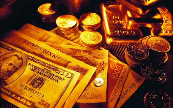 Gold Coins, Dollar Bills and Bars Closeup