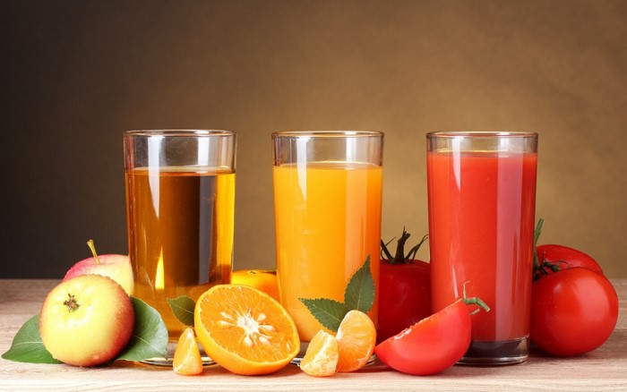 Three glasses of juice with fruits and vegetables