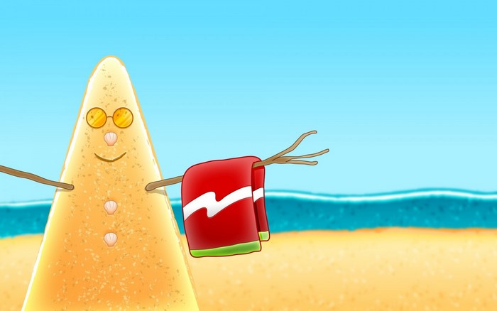Sand snowman with sunglasses and towel on beach
