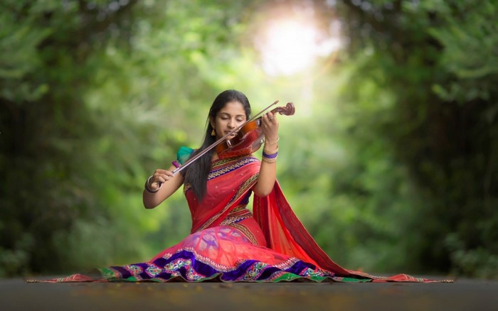 Woman in Saree Playing Violin Outdoors
