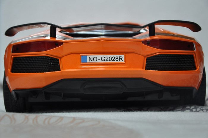 Orange Lamborghini Aventador with license plate NO-G2028R